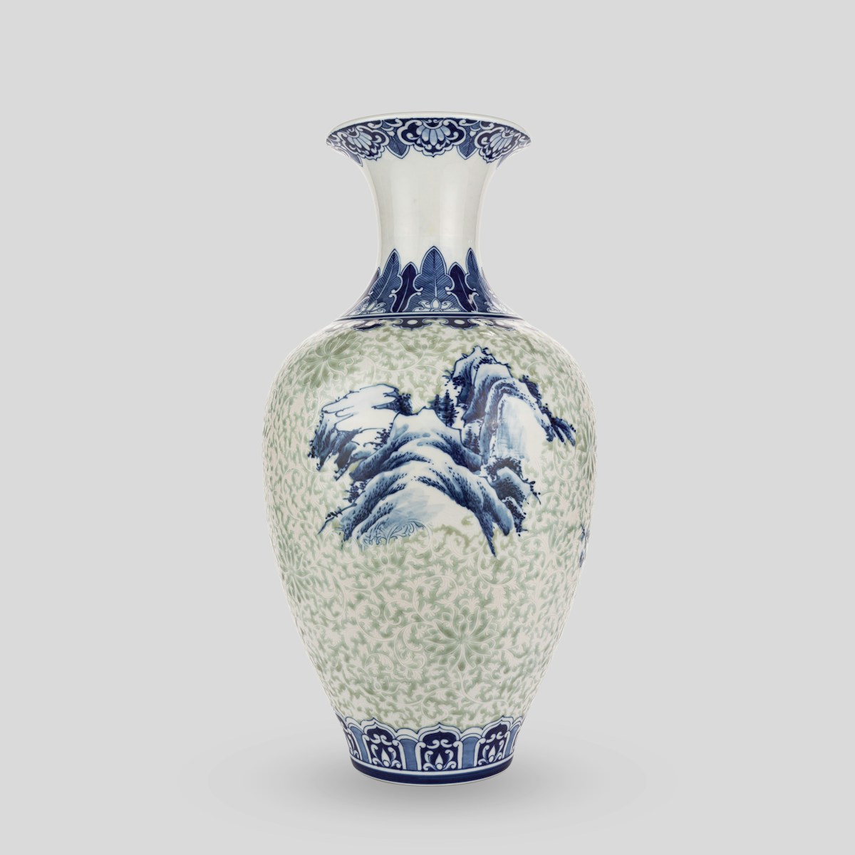 A blue and white vase sitting on top of a table